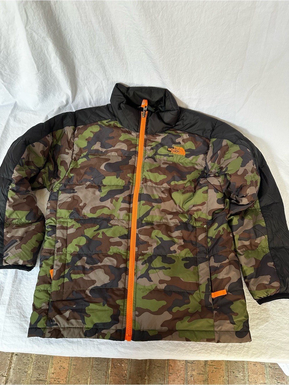 The North Face Kids Camo Puffer Jacket with Orange Zipper